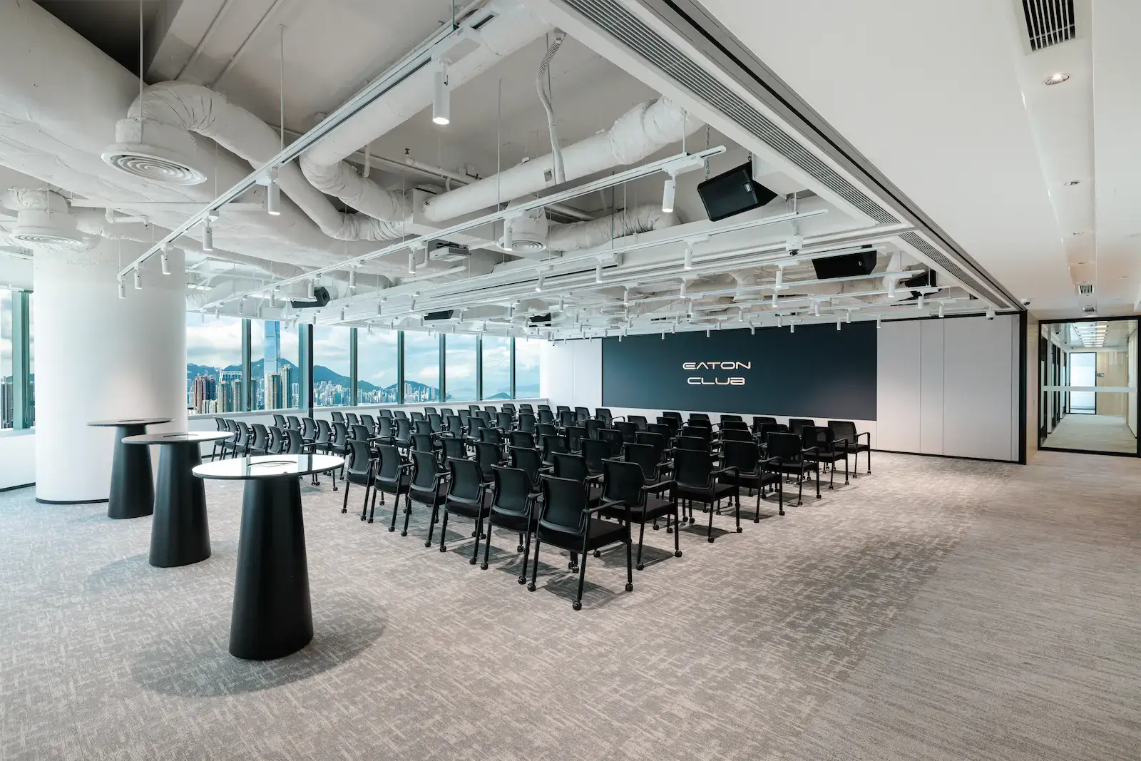 Eaton Club Kowloon event venue with theatre-style seating and panoramic city views.