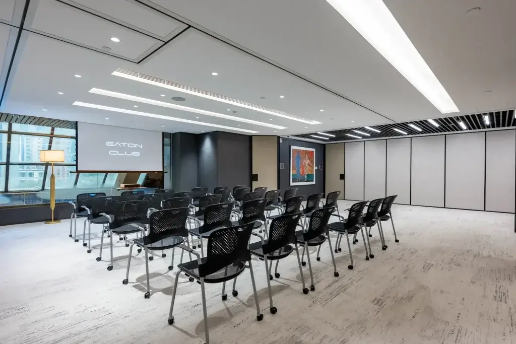 Eaton Club Wan Chai event venue with theatre-style seating and a projector screen.